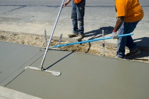 Workers laying concrete for a foundation in Hereford